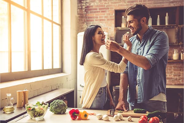 https://tower.top10mealdeliveryplans.com/wp-content/uploads/2023/06/Beautiful-young-couple-is-feeding-each-other-and-smiling-while-cooking-in-kitchen-at-home.jpg